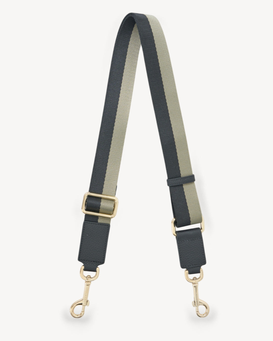 Two-tone bag strap with gold hardware on a white background