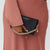 model wearing saben feature chain handle on saben nikko bag 